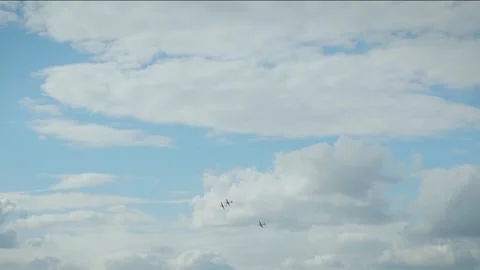 Airplane performing vertical dive with smoke trail in blue cloudy sky Stock Footage 340206287