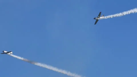 Airplane performs a series of rolls around another to simulate courtship Stock Footage 167909518