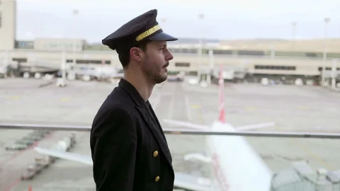 Airplane Pilot getting ready for flight at airport Terminal gate Stock Footage 98554753