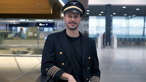 Airplane Pilot getting ready for flight at airport Terminal gate Stock Footage 98554845