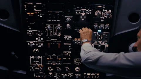 Airplane pilot operating controls in cockpit at night Stock-Footage 326180260