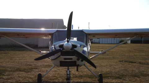 Airplane pilot prepares for takeoff, showcasing the aircrafts propeller and Видео 347871885