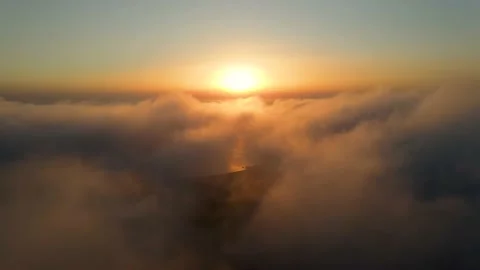 Airplane point of view flight over fluffy clouds into sunset Video stock 161251221
