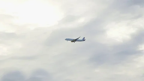 Airplane preparing to land in Venice With A Sun And Clouds Background Stock Footage 84977211