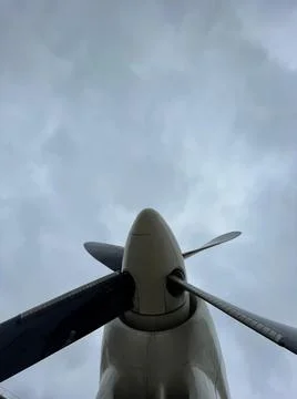 An airplane propeller from below is close Stock Photos