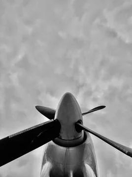 An airplane propeller from below is close Stock Photos