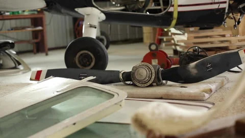 Airplane Propeller Lying On Floor Of Hangar Among Other Parts Stock-Footage 147005403