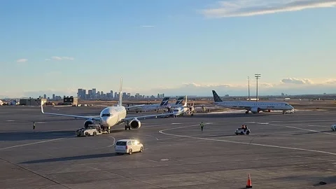 Airplane pushed out Calgary March 10 2026 Stock Footage 330759532