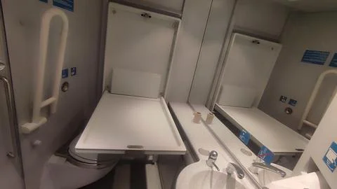 Airplane restroom changing table objects indoor interior white design edito.. Stock Photos