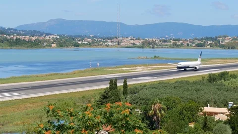 An airplane rolls down the runway Stock Footage 113013401
