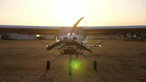 Airplane on runway during sunset, showcasing gradual light changes Stock Footage 318873301