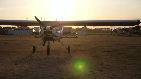 Airplane on runway during sunset, showcasing gradual light changes and shadow Video stock 323467490