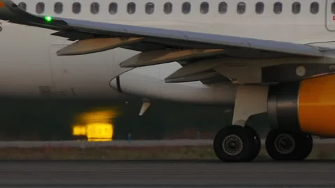Airplane on Runway at Sunset Close Up Stock Footage 336755592