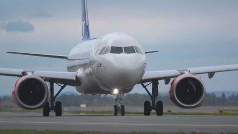 Airplane scandinavian airlines airbus 320 neo taxiing turning panning right Stock Footage