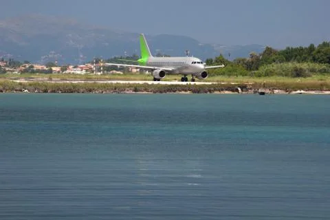 Airplane on a seashore Stock Photos