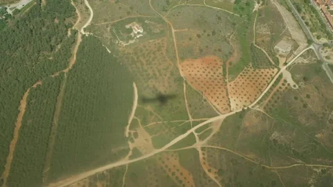 Airplane shadow crossing fields. Stock Footage 154436709