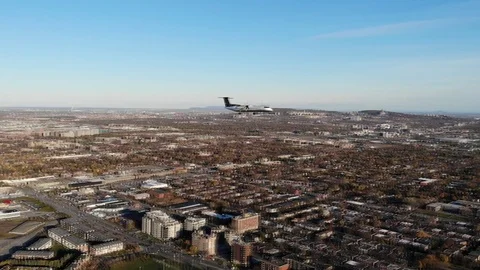 Airplane shot by a drone on the same altitude flyover propeller plane air canada Stock Footage