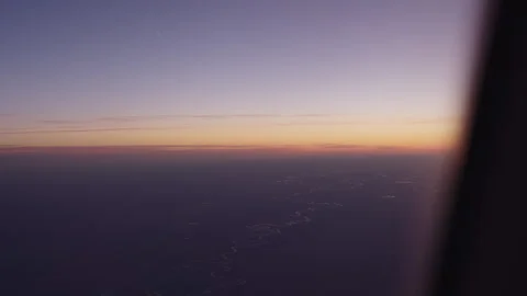 Airplane shot of flying over clouds in sunset Stock Footage 251326311