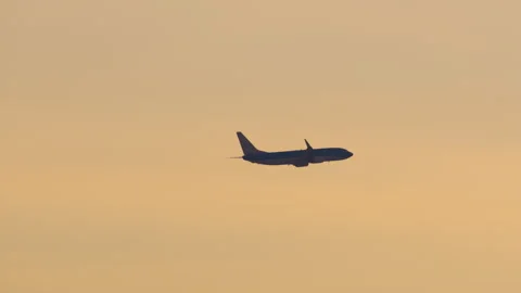 Airplane Silhouette Flying at Sunset Stock Footage 332421972