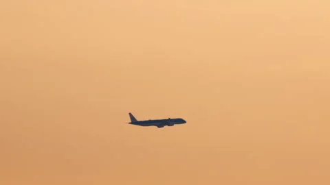 Airplane Silhouette Taking Off at Sunset Stock Footage 335029369
