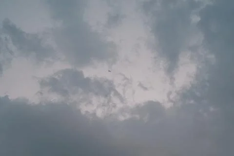 Airplane in the sky flying in the clouds Stock Photos