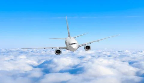 Airplane in the sky. Passenger jet air plane flying on blue sky white cloud.. Stock Photos