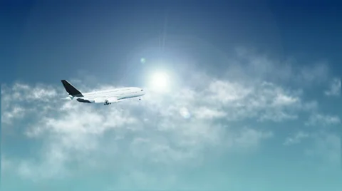 Airplane in Sky With Sun and Clouds Stock Footage 36184177