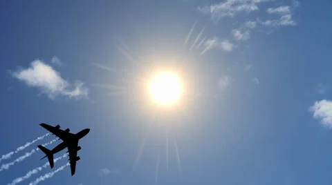 Airplane in Sky With Sun Stock Footage 34199196