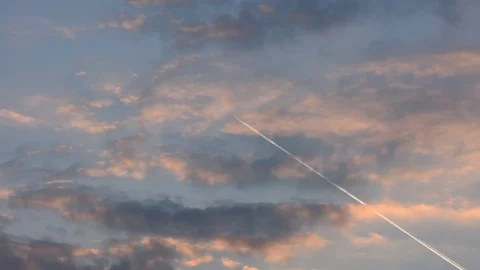 Airplane in the sky at the sunset  Stock Footage 126712311