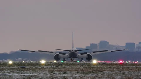 Airplane on Snowy Runway, Engine Thrust at Dawn or Dusk Stock Footage 341834409