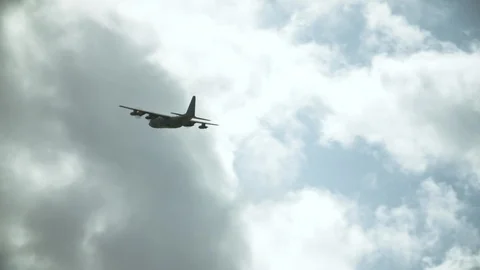 An airplane soaring in the sky Stock Footage 117741331