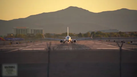 Airplane is speeding up and taking off from Harry Reid International Airport Stock Footage 273113529