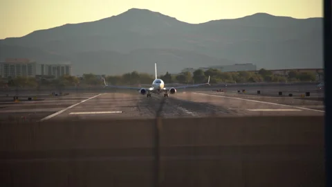 Airplane is speeding up and taking off from Harry Reid International Airport Stock Footage 273114368