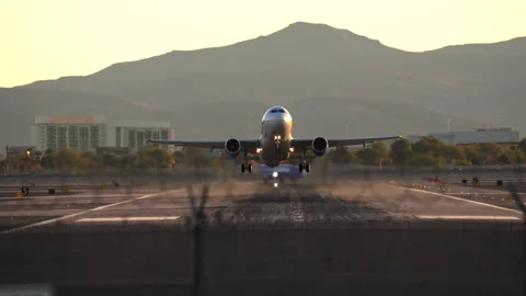 Airplane is speeding up and taking off from Harry Reid Stock Footage 273124628