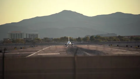 Airplane is speeding up and taking off from Harry Reid Stock Footage 273124832