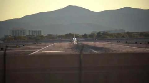 Airplane is speeding up and taking off from Harry Reid Stock Footage 273124943