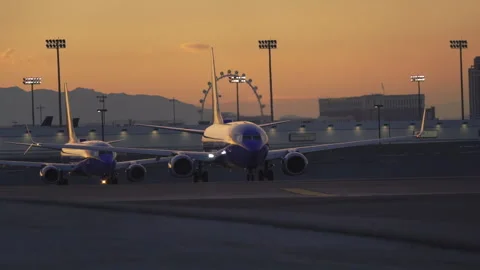 Airplane is speeding up and taking off from Harry Reid Airport in Las Vegas Stock Footage 273562860