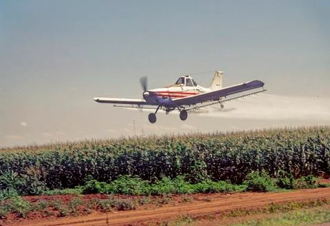 Airplane Spraying Crops Stock Photos