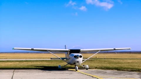 Airplane standing whilst his engine is on Stock Footage 85008440
