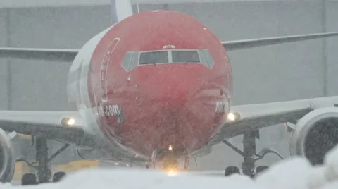 Airplane start taxiing heavy snow weather Stock Footage