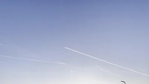Airplane streaks in the sky Stock Footage 263270082