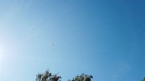 Airplane in sunny sky Stock Footage 137963943