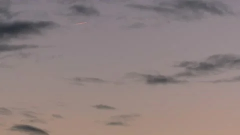 Airplane at sunrise with contrails - cloudscape - sky background Stock Footage 143255936