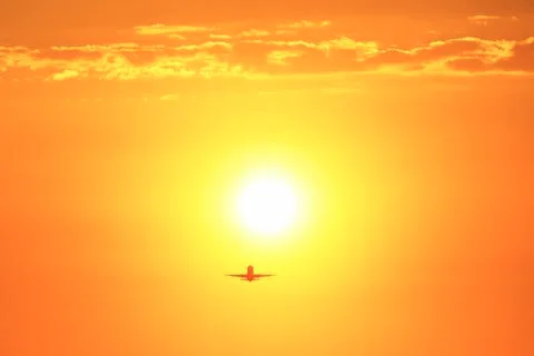 Airplane at sunset Stock Photos