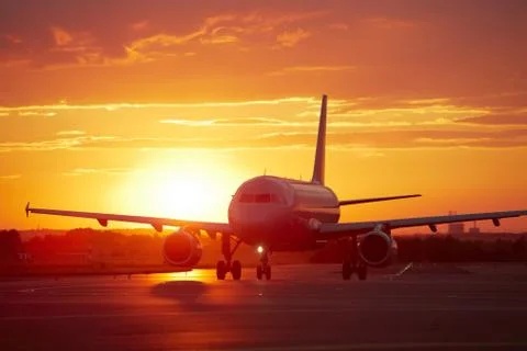 Airplane at sunset Stock-Fotos