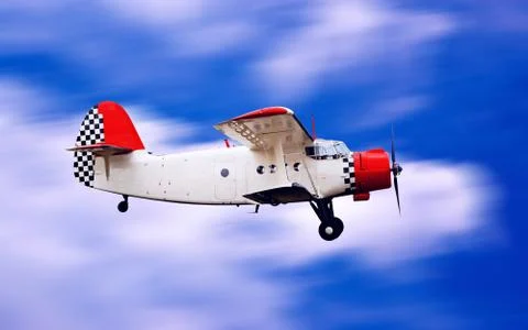 Airplane on sunset sky Stock Photos