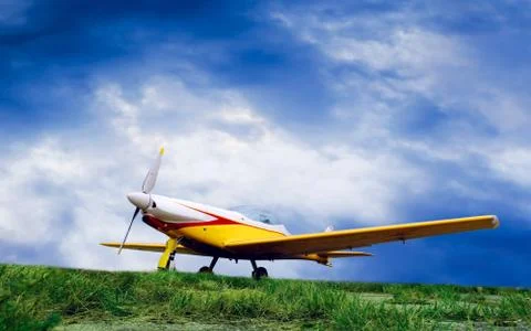 Airplane on sunset sky Stock Photos