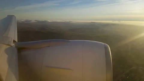 Airplane Sunset / Window / Engine Stock Footage