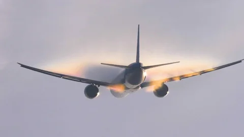 Airplane take off and creating rainbow Stock Footage 87685097