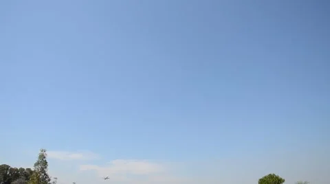 Airplane take off on a blue sky background Stock Footage 41582579